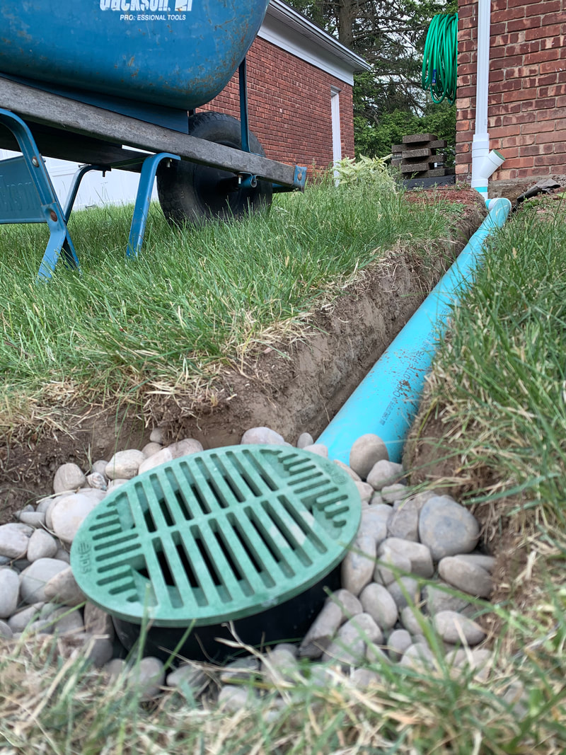 Drainage solutions for water issues outside a house. DIY drainage system ideas for building a french drain, underground downspout, catch basin, dry well, foundation drainage, yard drains. How to install outdoor drainage around a home and landscape.